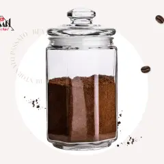 Barattolo di vetro pieno di caffè macinato, ideale per sapere come conservare il caffè macinato e mantenerne l'aroma.