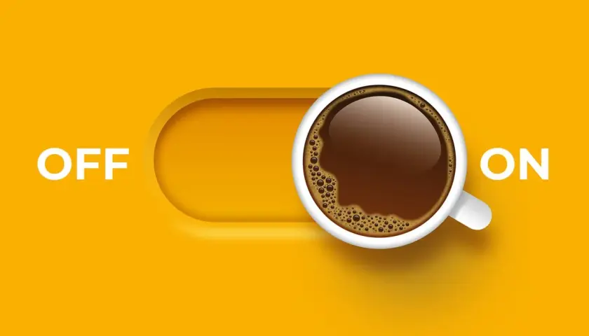 Interruttore "ON" con una tazza di caffè fumante, pronto a dare la carica con la sua caffeina.